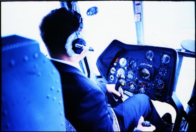 A pilot in a flight simulator, practicing emergency procedures with realistic visuals and instrument feedback.