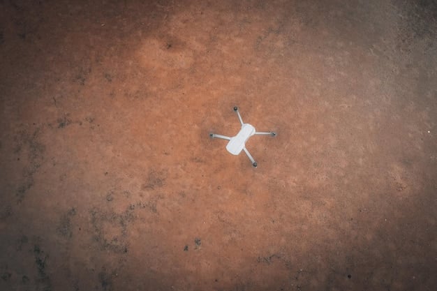 A close-up shot of a damaged drone lying on the ground next to a residential building, with emergency responders in the background, illustrating the aftermath of a drone incident.