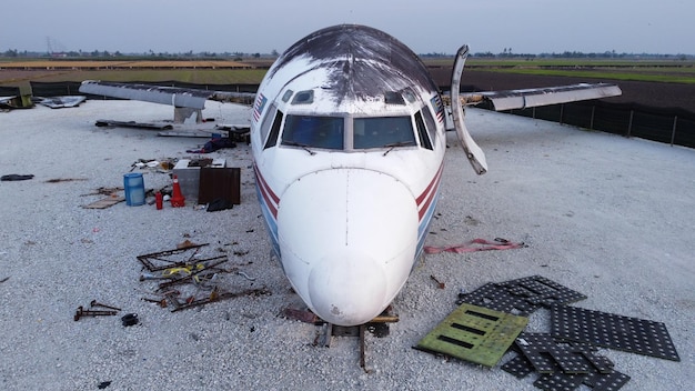 A damaged airplane wing after the failure of a critical component during flight, emphasizing the dangers of using spurious parts.