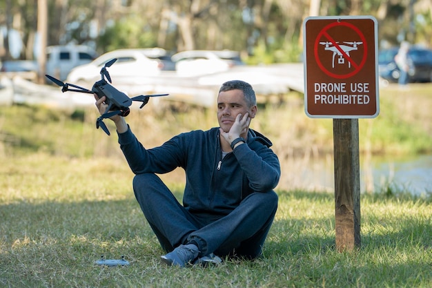 A drone pilot participating in a training session, focusing on the use of flight simulation software for emergency procedures.