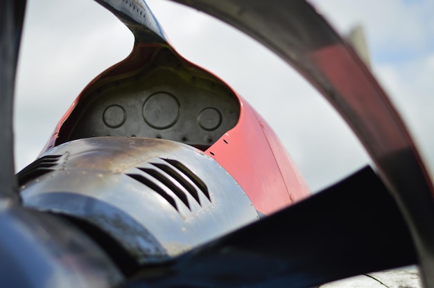 A close-up shot of an aircraft engine being fueled with Sustainable Aviation Fuel (SAF), highlighting the color difference from traditional jet fuel and emphasizing the eco-friendly aspect of SAF.