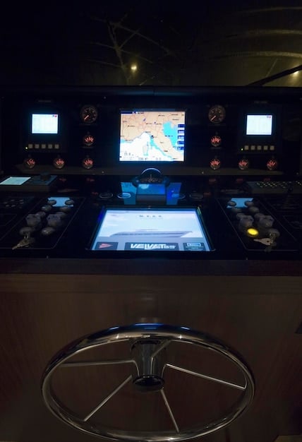 A close-up of a radar screen in an air traffic control tower, showing multiple aircraft tracks in close proximity.