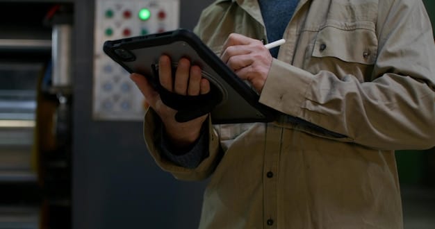 A person inspecting the undercarriage of a connected car, highlighting the importance of physical security checks and maintenance.