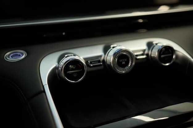 A close-up of a car's front grille showing the integration of radar sensors. The focus is on the sensors and the surrounding car design, emphasizing the seamless incorporation of ADAS technology.
