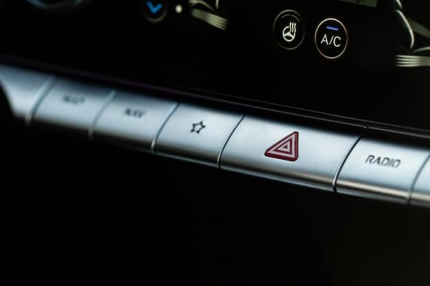 A close-up of a car's dashboard display showing a fingerprint scanner icon and a notification indicating 