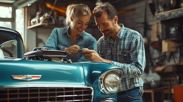 A close-up shot of two people working together on the engine of a classic car in a garage setting, showcasing the collaborative and learning aspects of car club culture. Tools and car parts are neatly organized in the background.