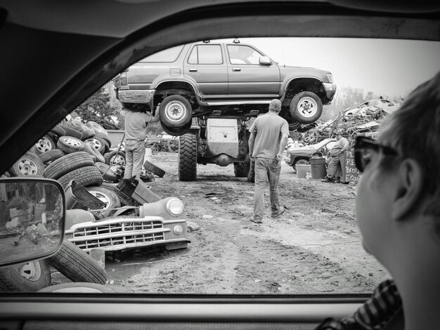 A time-lapse sequence showing the complete teardown of a classic car. Frames include the removal of the body from the chassis, engine disassembly, interior stripping, and the meticulous organization of parts. Each component is labeled and categorized, showing the systematic approach to the restoration process. This visual representation highlights the complexity and precision involved in preparing a vehicle for comprehensive restoration.