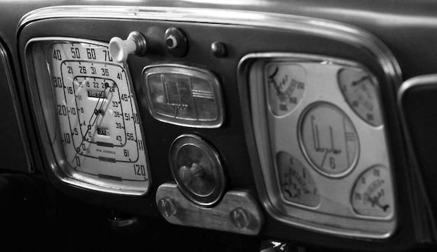 A close-up of a vintage car radio from the 1950s, showing the analog tuning dial and simple interface.
