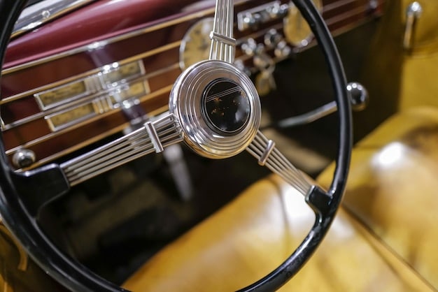 Close-up shot of a vintage steering wheel with aged leather and chrome details, symbolizing the historical significance and craftsmanship cherished by automotive collectors.
