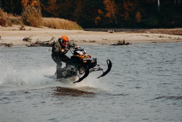 The BMW R 1250 GS Adventure navigating a rocky river crossing, showcasing its off-road capabilities and ruggedness.
