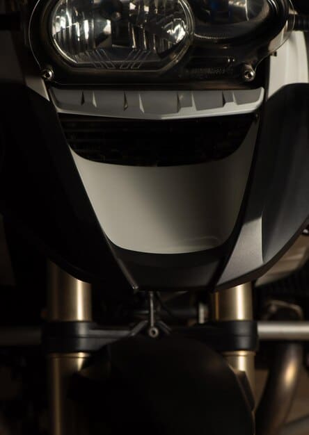 Close-up shot of the 2025 BMW R 1300 GS's new LED headlight design, highlighting its sleek and modern appearance and the improved visibility it offers.