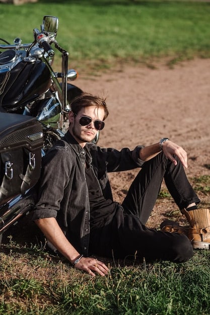 A rider comfortably seated on the 2025 Harley-Davidson Street Glide, showcasing the relaxed posture and comfortable seat. The rider is wearing a helmet and riding gear, and the bike is moving smoothly on the open road.