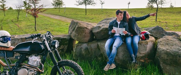 A rider comfortably seated on the DR650S, highlighting the bike's upright riding position and the ease of reaching the handlebars and controls. The image focuses on the rider's relaxed posture and the overall ergonomic design of the motorcycle.