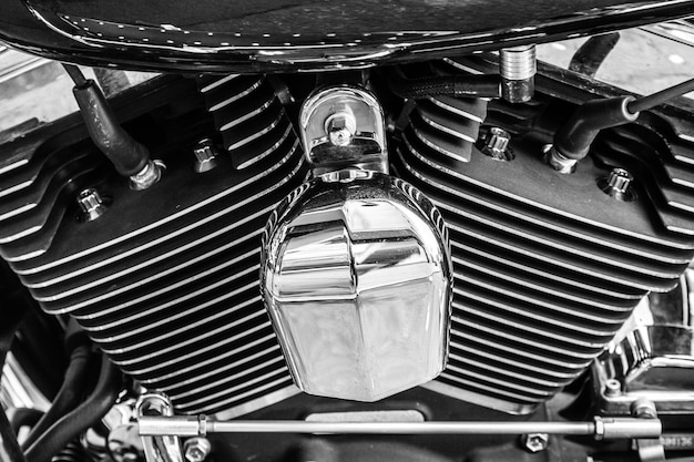 A close-up shot of the 2025 Suzuki DR650S engine, showcasing its air-cooled design and simple mechanics. The focus is on the engine's robust construction and classic dual-sport aesthetics.