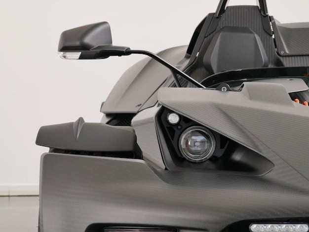 Clear shot of the Kawasaki Ninja 400's front end, showcasing the LED headlights and windscreen design. The image focuses on the bike's aggressive styling and modern lighting technology, which enhances both aesthetics and visibility.